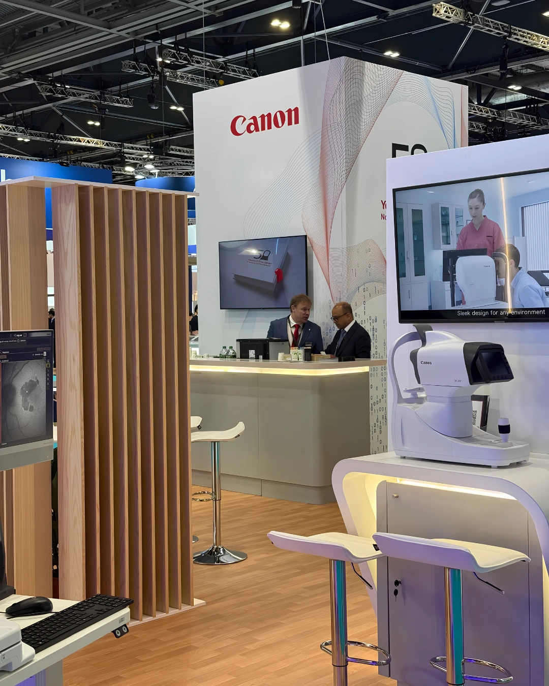 Canon exhibition stand with timber detailing, integrated lighting and ophthalmic product displays at ESCRS London 2026