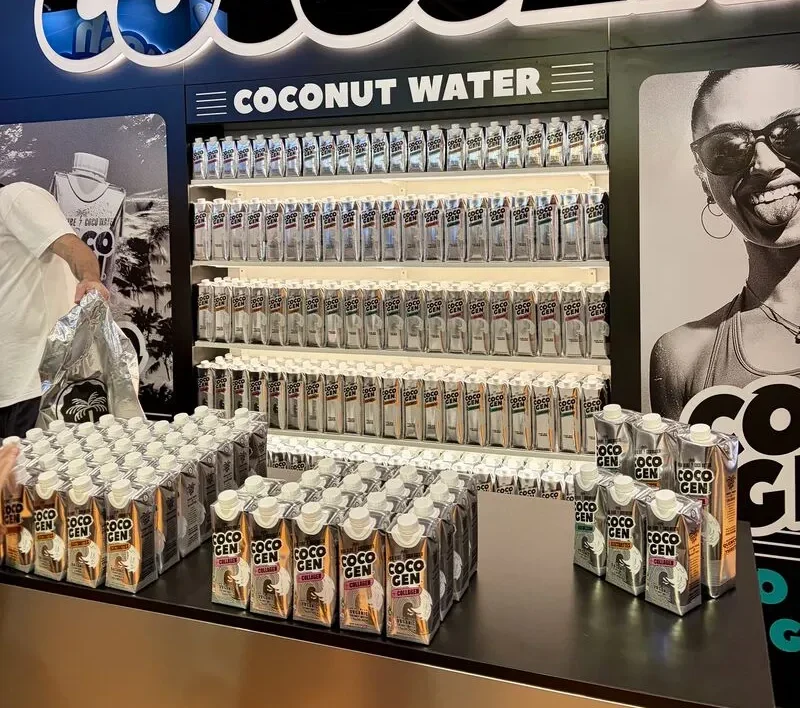 CocoGen product sampling stand with coconut water display and branded counter at Lunch! 2026